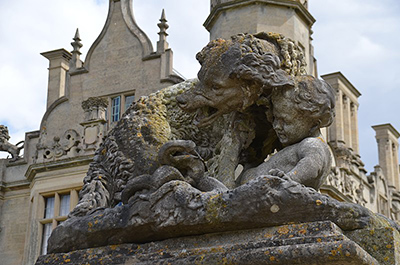 Gate at Harlaxton Manor with sculpture of Newfoundland Dog Saving a child from a snake