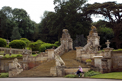 Gate at Harlaxton Manor with sculpture of Newfoundland Dog Saving a child from a snake