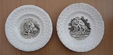 Porcelain plates with images of Newfoundland Dog Saving a child from a snake